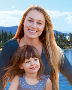 Woman with her daughter smiling because they love their dentist